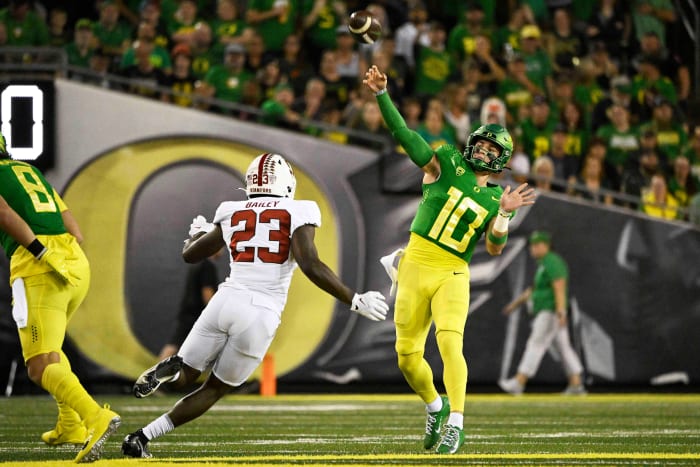Oregon, USA; Oregon Ducks quarterback Bo Nix (10) throws a pass during the first half against Stanford Cardinal defensive end David Bailey (23) at Autzen Stadium.